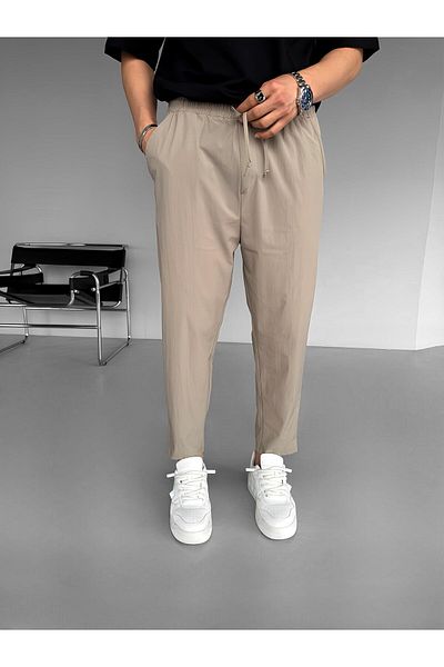 ablukaonline Beige Men's Slim Fit Carrot Cut Parachute Fabric Elastic Trousers