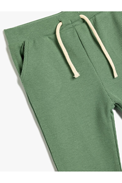Koton Spodnie dresowe z teksturą bawełnianą - model podstawowy z wiązaniem w pasie