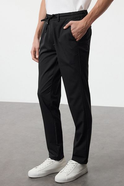 Trendyol Collection Schwarze Slim-Fit-Hose aus gewebtem Stoff mit Bindedetail an der Taille TMNAW25PL00029