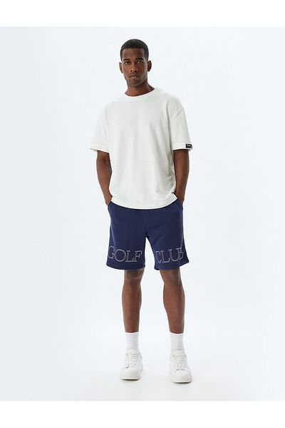 Koton Oversize αθλητικό σορτς από βαμβακερό μείγμα - με στάμπα με σλόγκαν και με λεπτομέρειες στην τσέπη