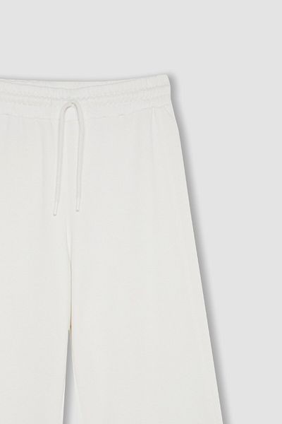 DeFacto Spodnie dresowe Standard Fit Thick Jogger Basic z prostym stanem i szeroką nogawką, z gumką, o długim fasonie D6274Ax24Au