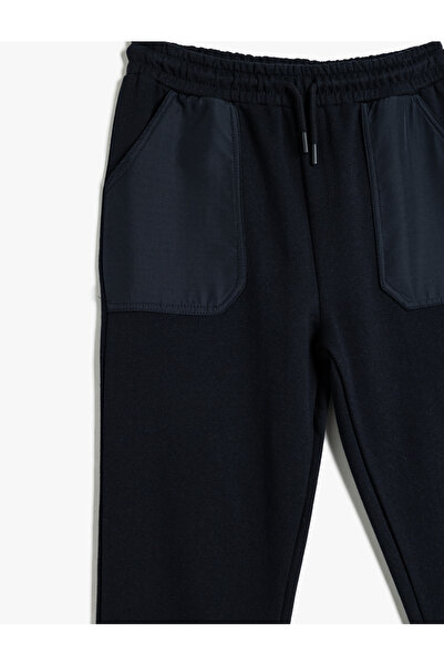 Koton Kocogó melegítőnadrág zsebekkel és nyakkendővel a derekán