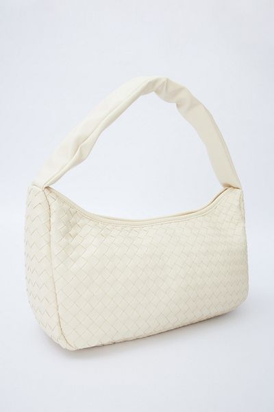 Manuka Beigefarbene ovale Frances-Stricktasche