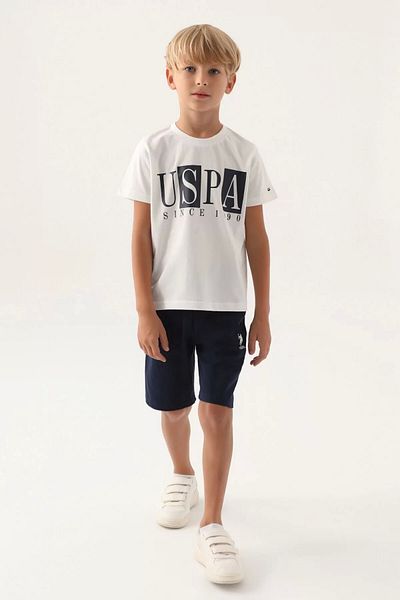 U.S. Polo Assn. بدلة برمودا للأولاد باللون الكريمي المرخص من US Polo Assn