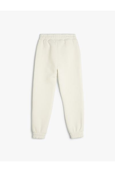 Koton Bedruckte Jogger-Jogginghose – elastische Taille, Taschen und Raster