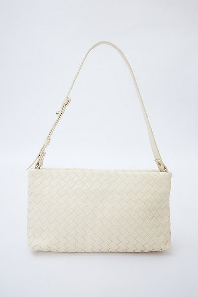 Manuka Beigefarbene gestrickte Baguette-Tasche von Frances