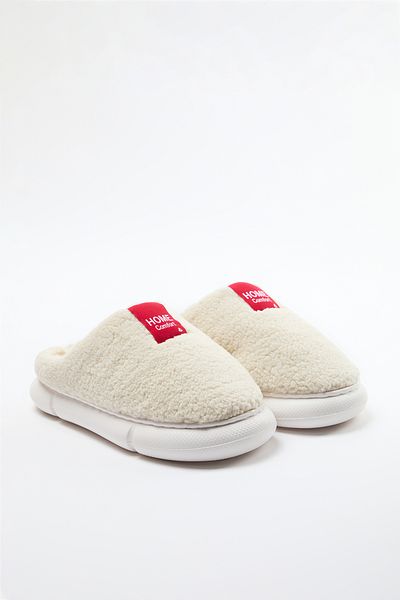 TRENDYOL SHOES Bézs plüss szőtt címke részletes női házi papucs TAKAW25ER00012