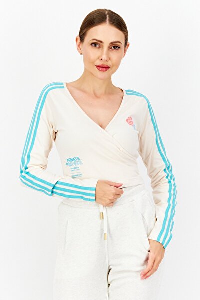 adidas قميص تدريب رياضي نسائي بأكمام طويلة، كريمي