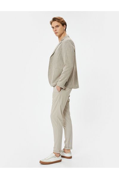Koton Stoffhose Slim Fit, elastische Taille, geknöpfte Tasche, detailliertes, gefaltetes Bein