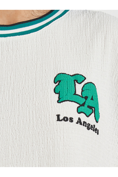 Styli Oversized Textured T-Shirt with High-Low Hem