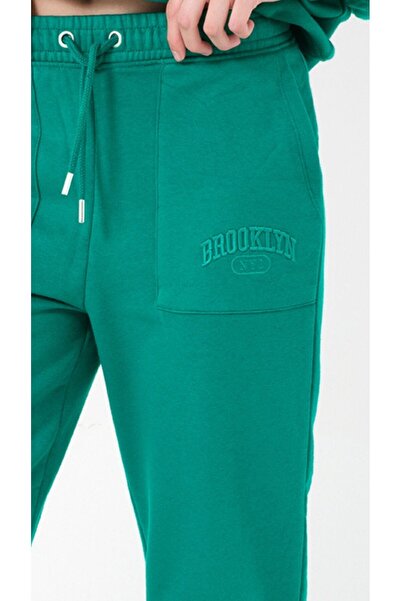 Kyron Πράσινη γυναικεία φόρμα - με τσέπες και μανσέτες