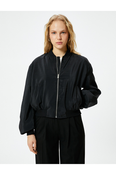 Koton Bunda padákového bombardéru s detailem kapsy na zip