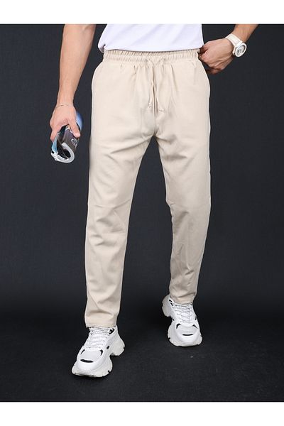 mavisima erkek giyimi Ανδρικό παντελόνι Jogger σε μπεζ λεπτή εφαρμογή, χαλαρή γραβάτα στη μέση, πλαϊνές τσέπες και πίσω τσέπες
