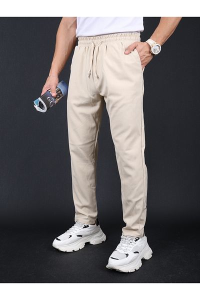 mavisima erkek giyimi Ανδρικό παντελόνι Jogger σε μπεζ λεπτή εφαρμογή, χαλαρή γραβάτα στη μέση, πλαϊνές τσέπες και πίσω τσέπες