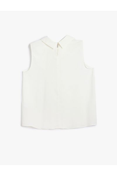 Koton Asymmetrische, ärmellose Bluse mit Hemdkragen und Knopfdetail