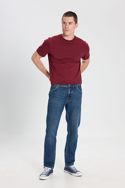 WRANGLER بنطال جينز رجالي ذو قصة ضيقة وخصر عادي وأرجل ضيقة باللون الأزرق من تكساس جان
