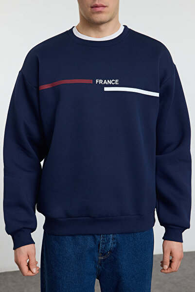 Trendyol Collection Sötétkék túlméretes polár nyomott pulóver - TMNAW25SW00187