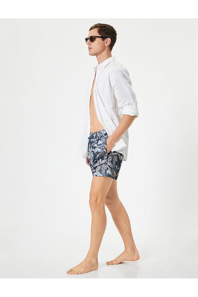 Koton Blattschnür-Badeshorts mit Blattmuster
