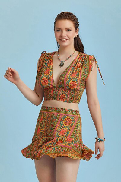 Los banditos Помаранчева міні-спідниця з воланами та візерунком