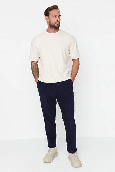 Trendyol Collection Tepláky z námořnické modři Regular/Normal Cut Labeled Gumové nohavice proti žmolkování Tmnaw23Ea00061