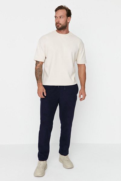 Trendyol Collection Tepláky z námořnické modři Regular/Normal Cut Labeled Gumové nohavice proti žmolkování Tmnaw23Ea00061