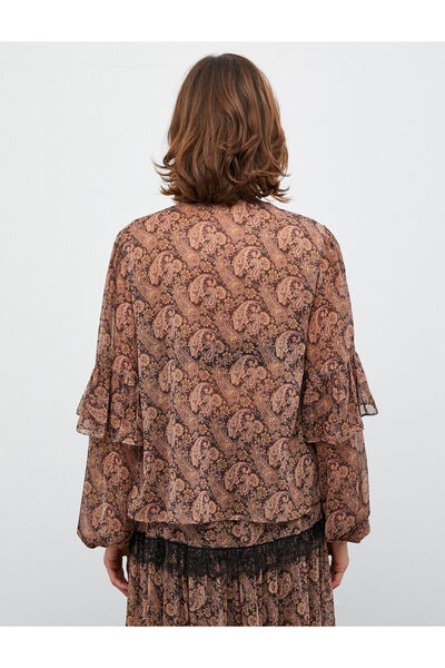 Koton Melis Ağazat X Koton - Szyfonowa bluzka z frędzlami i rękawami balonowymi