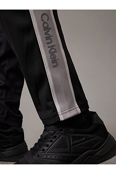 Calvin Klein Men's Regular Fit Pleated Side Stripes Elastic Waist Black Sweatpants 00Gmf4P604-Bae