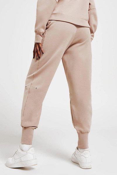 Nike Γυναικείο αθλητικό παντελόνι Tech Fleece Pink - Φαρδιά, χαλαρή εφαρμογή
