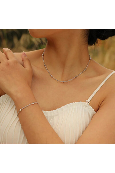 CAXBERN طقم قلادة وسوار من الفولاذ الفضي بتصميم دوريكا