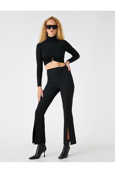 Koton Kurz geschnittene Hose mit weitem Bein und Schlitzdetail
