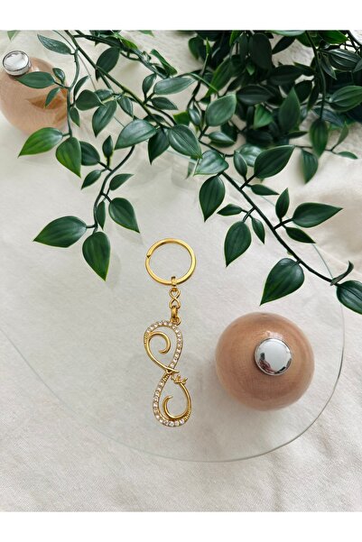 İthal سلسلة مفاتيح حجرية برمز إنفينيتي ذهبي