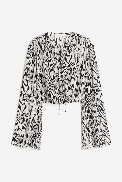 H&M بلوزة ملفوفة مقصوصة