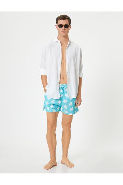 Koton Badeshorts mit Schildkröten-Print – Taschen und Schnürsenkel in der Taille