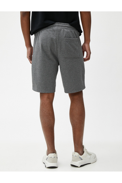 Koton Kraťasy se zipem a kapsami s detailem Slogan a krajkovým Slim Fit v pase