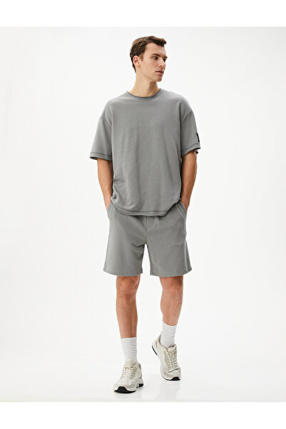 Koton Βασικό υφαντό σορτς με κορδόνια στη μέση και λεπτομέρεια τσέπης