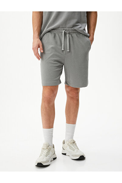 Koton Βασικό υφαντό σορτς με κορδόνια στη μέση και λεπτομέρεια τσέπης