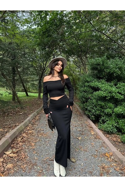 HARMONY GLOBAL Μαύρη μπλούζα με λαιμόκοψη Madonna και ασύμμετρη σχισμένη φούσ...