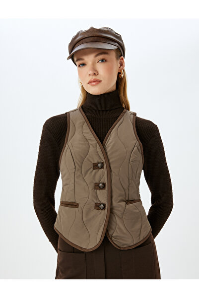 Koton Geknöpfte, gerippte, ärmellose, gesteppte Weste mit V-Ausschnitt und Taschendetail