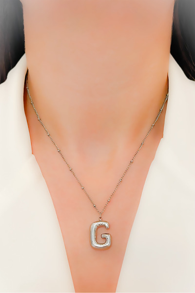 Trinos قلادة من الفولاذ مع حرف بالون - دوريكا V2