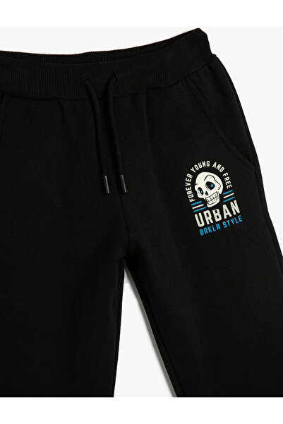 Koton Jogger Eşofman Altı Cepli Beli Bağlamalı Kuru Kafa Baskılı Şardonlu