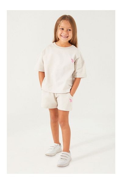 U.S. Polo Assn. قاعدة. طقم شورت بناتي بلون كريمي مفتوح سادة من Polo Assn