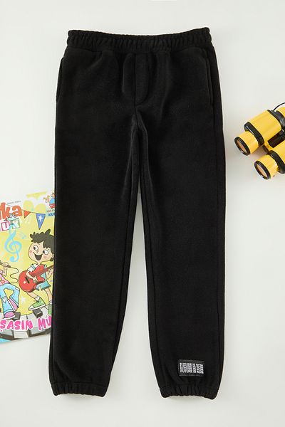 TRENDYOLKIDS Black Boy Knitted Mini Me tepláky Tkdaw25Ea00016