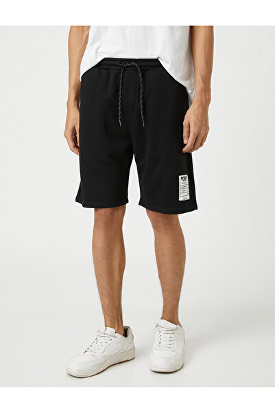 Koton Základní šortky s krajkovým pasem s potištěnými kapsami s logem štítku