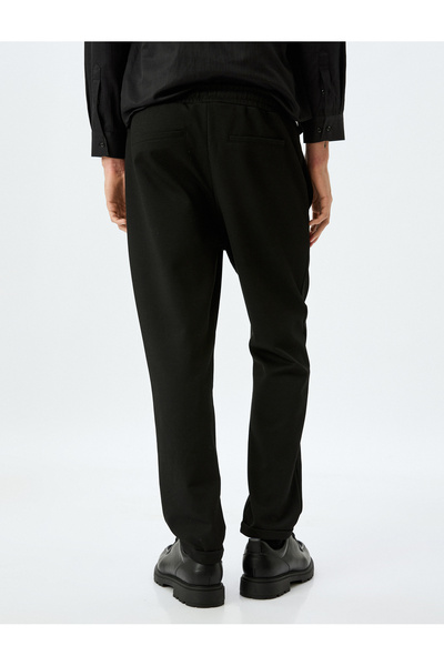 Koton Viskon Karışımlı Cep Detaylı Katlamalı Paça Beli Bağcıklı Pantolon