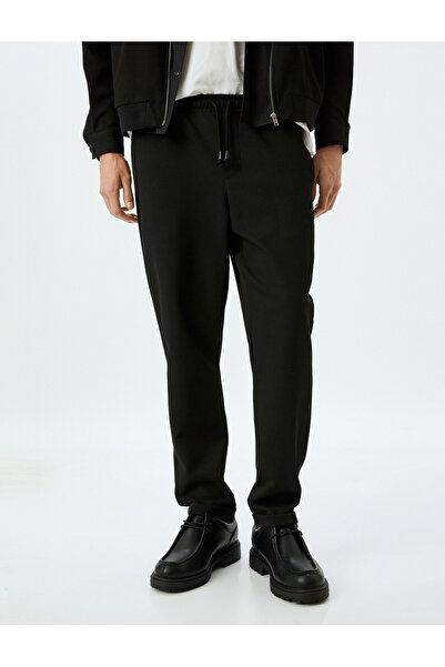 Koton Viskon Karışımlı Cep Detaylı Katlamalı Paça Beli Bağcıklı Pantolon