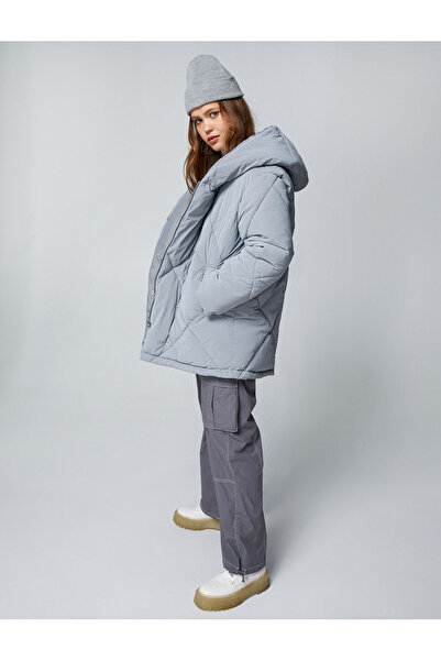 Koton Негабаритні надувні пальто з капюшоном і стьобаними кишенями Детальніше