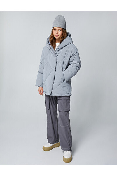 Koton Негабаритні надувні пальто з капюшоном і стьобаними кишенями Детальніше