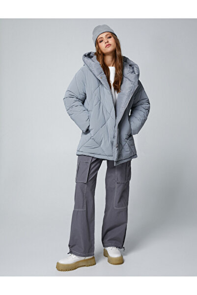 Koton Негабаритні надувні пальто з капюшоном і стьобаними кишенями Детальніше