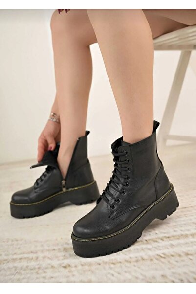 Özkan Ayakkabı SİYAH CİLT KALIN TABAN SARI DİKİŞ DETAYLI KADIN BOT