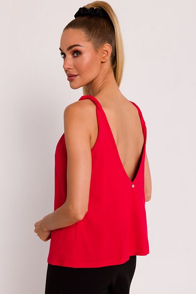 MOE This elegant top features a flattering V-neckline, twisted straps, and a deep V-cut back
